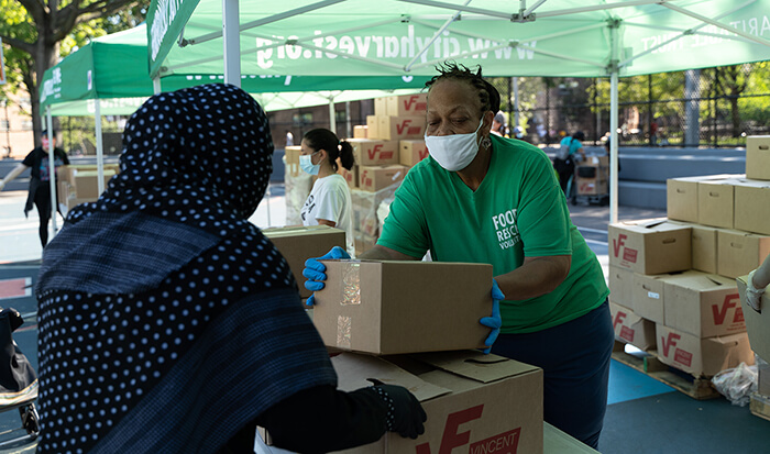 City Harvest stacking boxes of donations